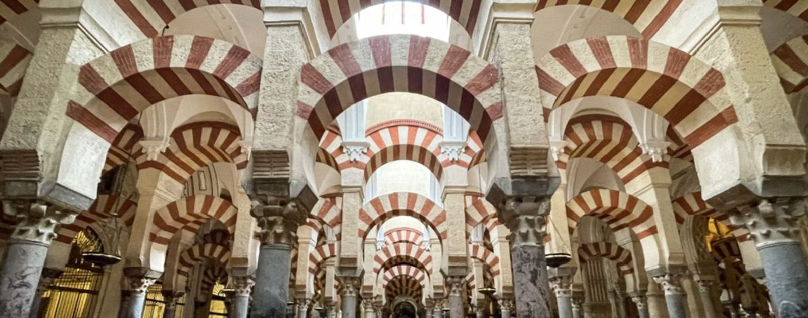 The striped horseshoe arches inside the Mezquita of Córdoba